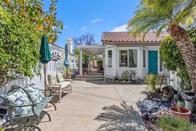 4763 Miletus Way, Oceanside, CA 92056 - fenced backyard featuring a patio, a pergola, a carport, and driveway