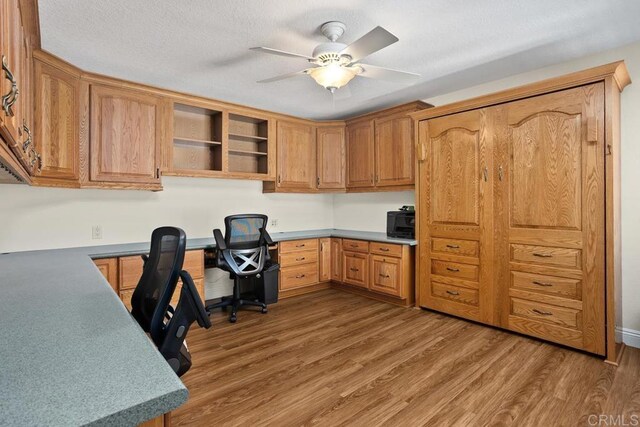 4763 Miletus Way, Oceanside, CA 92056 - office space with built in study area, wood finished floors, and a ceiling fan