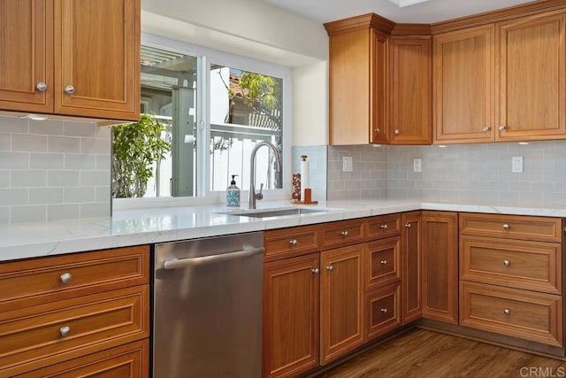 4763 Miletus Way, Oceanside, CA 92056 - kitchen featuring stainless steel dishwasher, brown cabinets, dark wood-style floors, tasteful backsplash, and light stone countertops