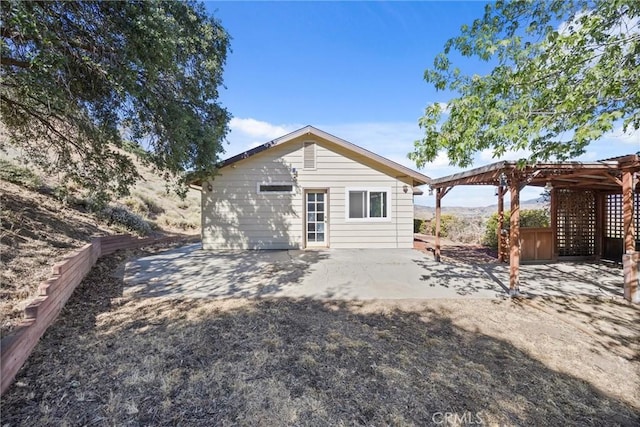 27861 Cummings Valley Rd, Tehachapi, CA 93561 - rear view of property featuring a pergola and a patio area