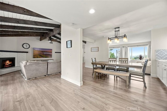 4021 Pikes Peak Dr, Norco, CA 92860 - dining room featuring a fireplace, light wood finished floors, a ceiling fan, a chandelier, and recessed lighting