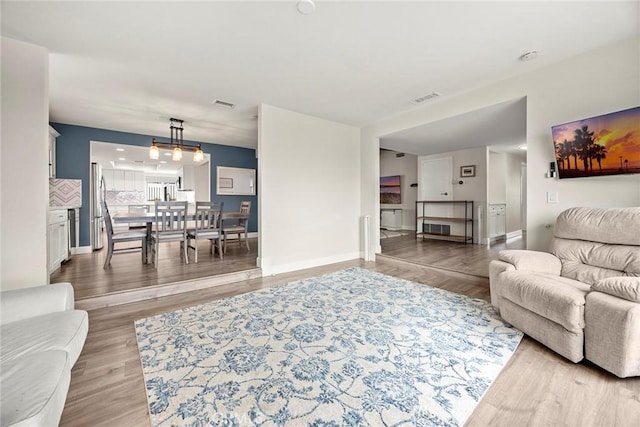 4021 Pikes Peak Dr, Norco, CA 92860 - living area featuring light wood-type flooring and baseboards