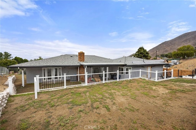 4021 Pikes Peak Dr, Norco, CA 92860 - back of property featuring a chimney and a mountain view