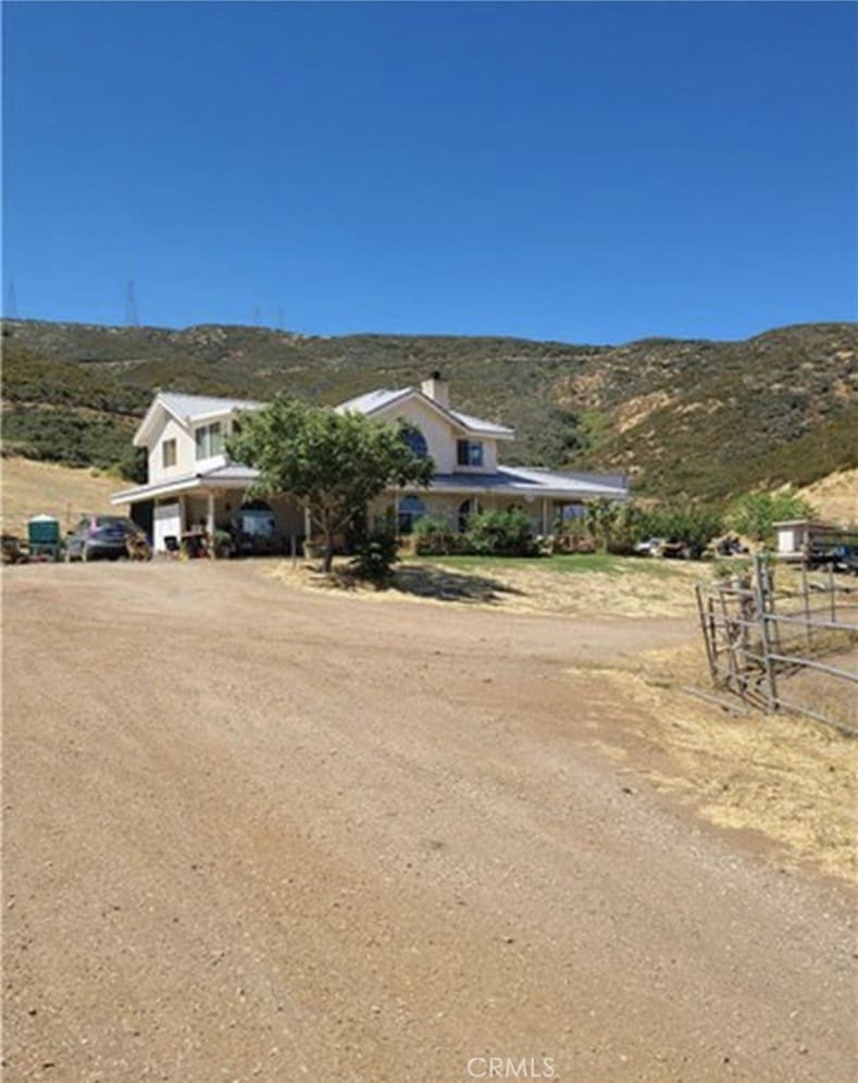 38810 Rogers Creek Rd, Palmdale, CA 93551 - view of front of property with a mountain view, a view of rural / pastoral area, and driveway