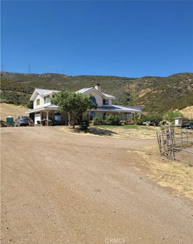 38810 Rogers Creek Rd, Palmdale, CA 93551 - view of front of property with a mountain view, a view of rural / pastoral area, and driveway
