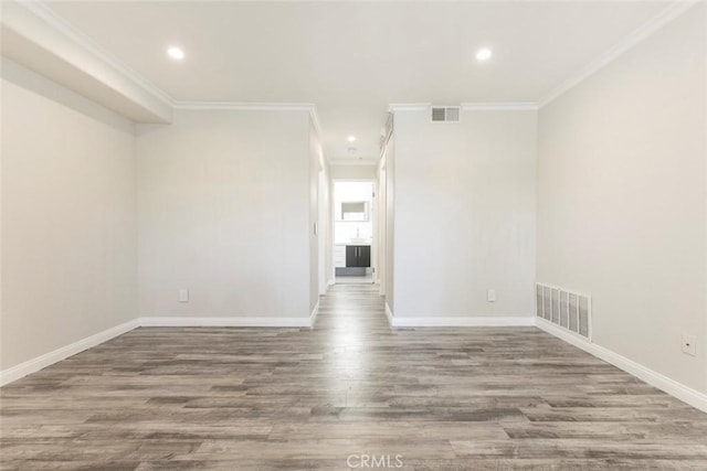 15114 Sherman Way Unit 106, Van Nuys, CA 91405 - unfurnished room with ornamental molding, recessed lighting, and wood finished floors