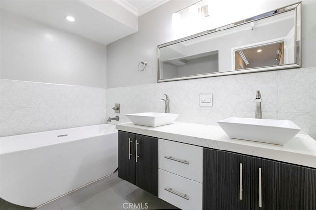 15114 Sherman Way Unit 106, Van Nuys, CA 91405 - full bath with a tub to relax in, double vanity, tile walls, crown molding, and tile patterned flooring