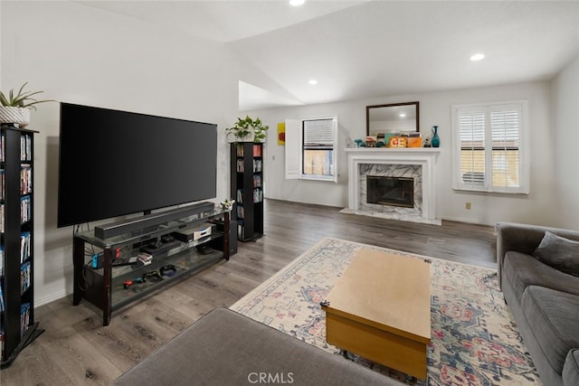 411 Spanish Moss Ln, Arroyo Grande, CA 93420 - living room with wood finished floors, lofted ceiling, a high end fireplace, and recessed lighting