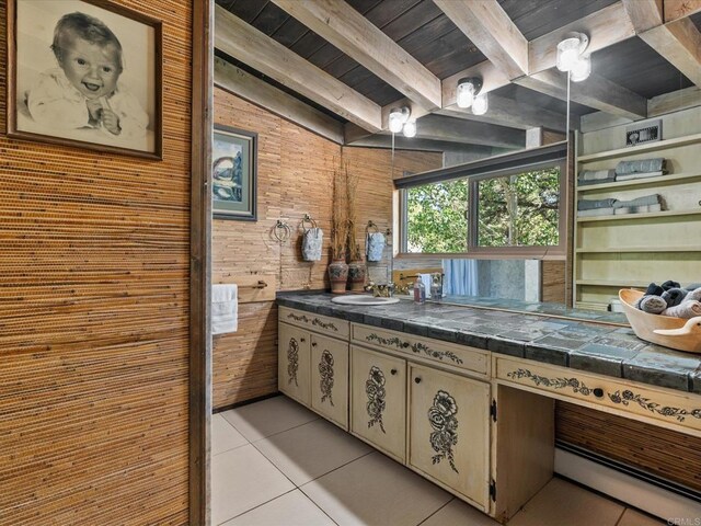 1082 Mountain Canary Dr, South Lake Tahoe, CA 96150 - bathroom with tile patterned floors, a wood ceiling with exposed beams, vanity, and wooden walls