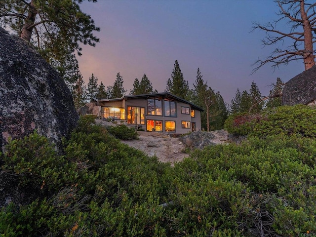 1082 Mountain Canary Dr, South Lake Tahoe, CA 96150 - view of back of property at dusk