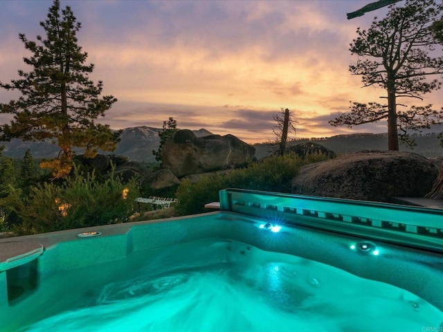 1082 Mountain Canary Dr, South Lake Tahoe, CA 96150 - pool at dusk featuring a mountain view