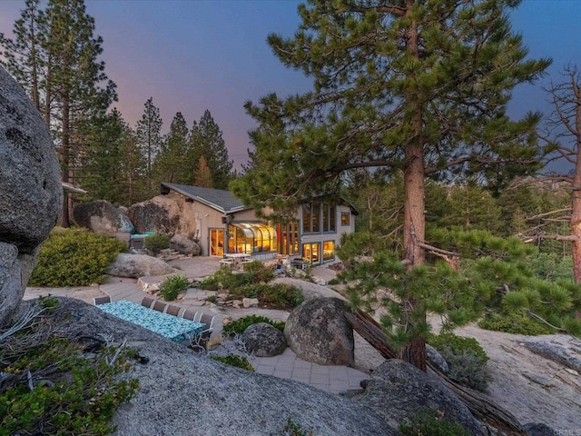 1082 Mountain Canary Dr, South Lake Tahoe, CA 96150 - view of back of house at dusk
