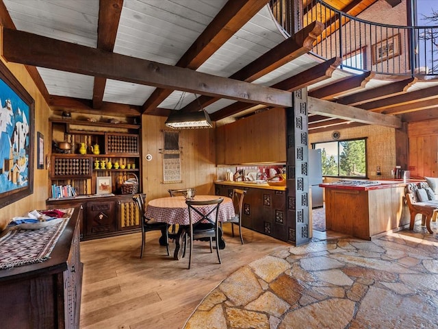 1082 Mountain Canary Dr, South Lake Tahoe, CA 96150 - dining area with wooden walls, beam ceiling, light wood finished floors, and stairway