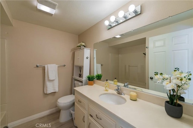 2245 Via Mariposa E Unit D, Laguna Woods, CA 92637 - bathroom with a shower, vanity, wood finished floors, and a bath