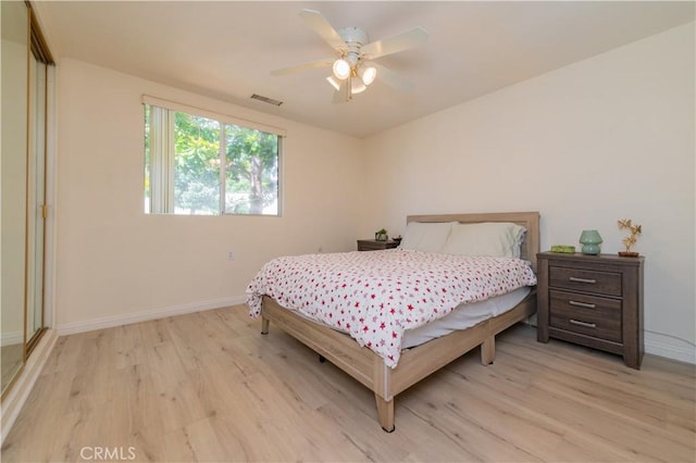 2245 Via Mariposa E Unit D, Laguna Woods, CA 92637 - bedroom with light wood finished floors and ceiling fan
