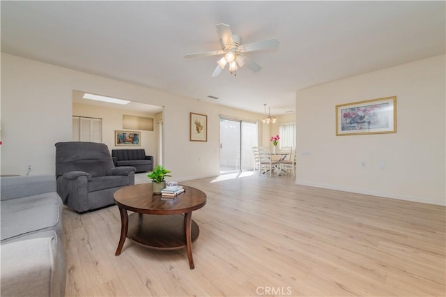 2245 Via Mariposa E Unit D, Laguna Woods, CA 92637 - living room featuring light wood-style floors and ceiling fan