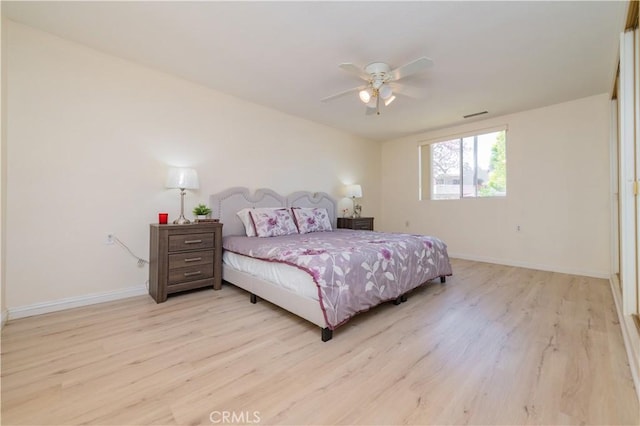 2245 Via Mariposa E Unit D, Laguna Woods, CA 92637 - bedroom with light wood finished floors and a ceiling fan
