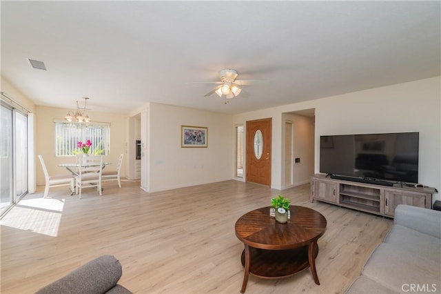2245 Via Mariposa E Unit D, Laguna Woods, CA 92637 - living area with a chandelier, light wood finished floors, and ceiling fan