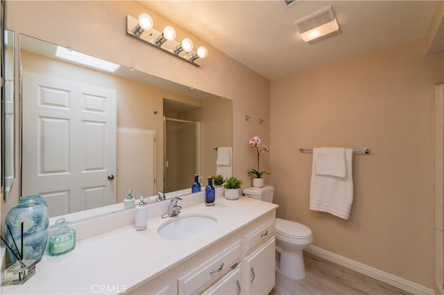 2245 Via Mariposa E Unit D, Laguna Woods, CA 92637 - full bath with wood finished floors, vanity, and a shower with door