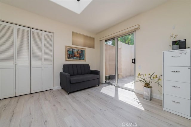 2245 Via Mariposa E Unit D, Laguna Woods, CA 92637 - living area featuring light wood-style floors