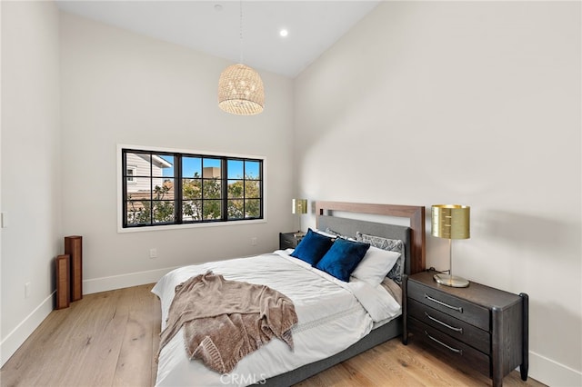 1963 Port Edward Pl, Newport Beach, CA 92660 - bedroom with high vaulted ceiling, light wood-style floors, a chandelier, and recessed lighting