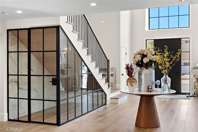 1963 Port Edward Pl, Newport Beach, CA 92660 - entrance foyer with wood finished floors, a towering ceiling, stairway, and recessed lighting