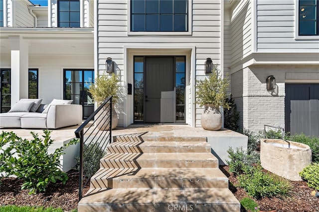 1963 Port Edward Pl, Newport Beach, CA 92660 - view of exterior entry featuring a porch and brick siding