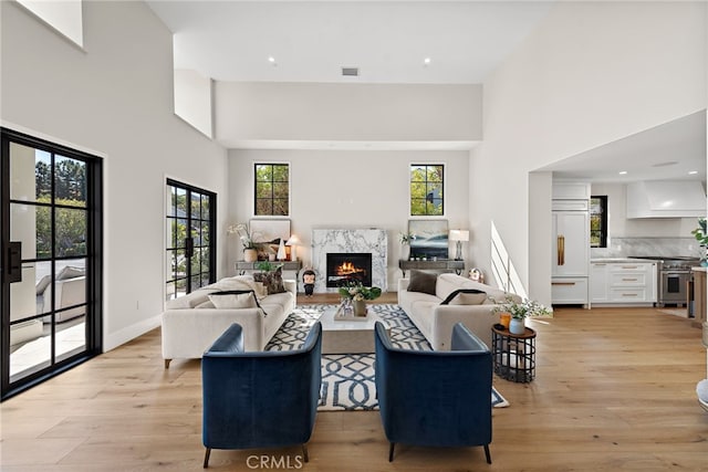 1963 Port Edward Pl, Newport Beach, CA 92660 - living area featuring a high ceiling, a premium fireplace, light wood-style flooring, and recessed lighting