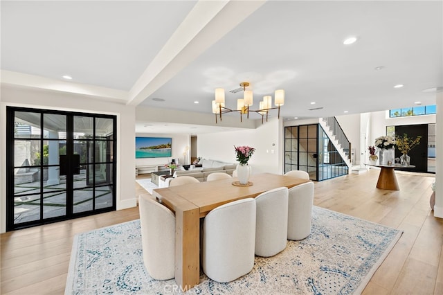 1963 Port Edward Pl, Newport Beach, CA 92660 - dining room featuring stairs, a chandelier, wood finished floors, recessed lighting, and french doors