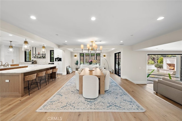 1963 Port Edward Pl, Newport Beach, CA 92660 - dining room featuring a chandelier, light wood-style floors, and recessed lighting