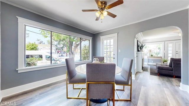 243 N Verdugo Rd, Glendale, CA 91206 - dining area with a ceiling fan, arched walkways, ornamental molding, and wood finished floors