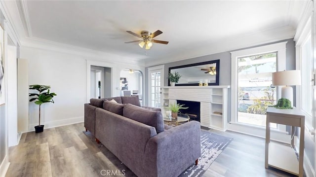 243 N Verdugo Rd, Glendale, CA 91206 - living area with plenty of natural light, ceiling fan, wood finished floors, a fireplace with flush hearth, and crown molding