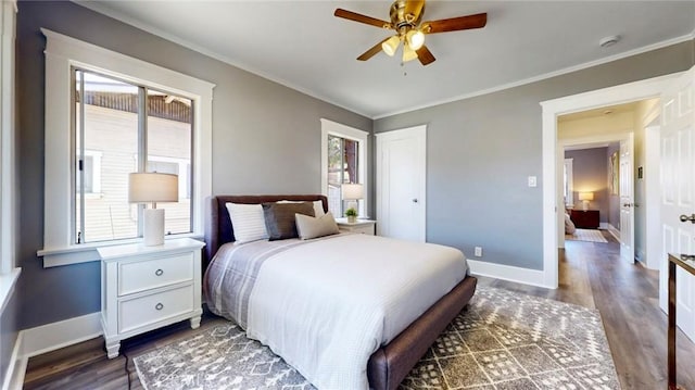 243 N Verdugo Rd, Glendale, CA 91206 - bedroom with multiple windows, crown molding, dark wood-type flooring, and a closet
