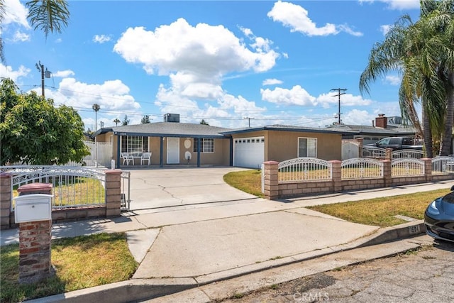 1504 Valaria Dr, Highland, CA 92346 - ranch-style home with driveway, a fenced front yard, an attached garage, and a gate