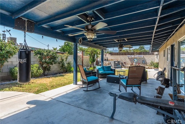 1504 Valaria Dr, Highland, CA 92346 - fenced backyard with an outdoor hangout area, ceiling fan, and a patio