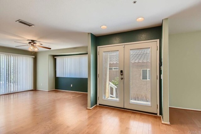 1413 San Miguel Ave, Spring Valley, CA 91977 - entrance foyer with french doors, light wood-style floors, plenty of natural light, and a ceiling fan