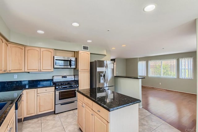 1413 San Miguel Ave, Spring Valley, CA 91977 - kitchen featuring appliances with stainless steel finishes, light brown cabinetry, light tile patterned floors, and recessed lighting