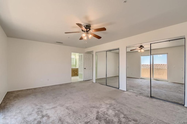 1413 San Miguel Ave, Spring Valley, CA 91977 - unfurnished bedroom with two closets, carpet floors, ceiling fan, and connected bathroom