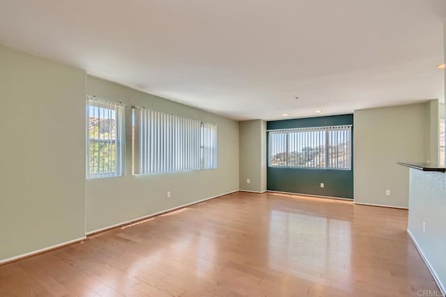 1413 San Miguel Ave, Spring Valley, CA 91977 - spare room featuring healthy amount of natural light and wood finished floors