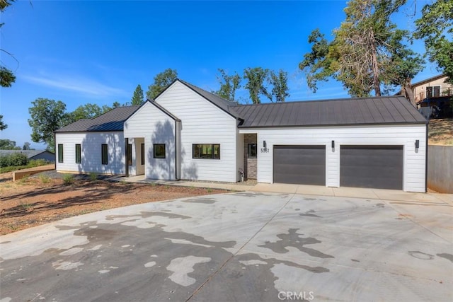 5351 Filbert St, Paradise, CA 95969 - modern farmhouse with a metal roof, a garage, and driveway