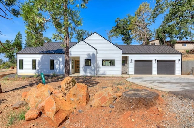 5351 Filbert St, Paradise, CA 95969 - modern farmhouse with a garage, a metal roof, and driveway