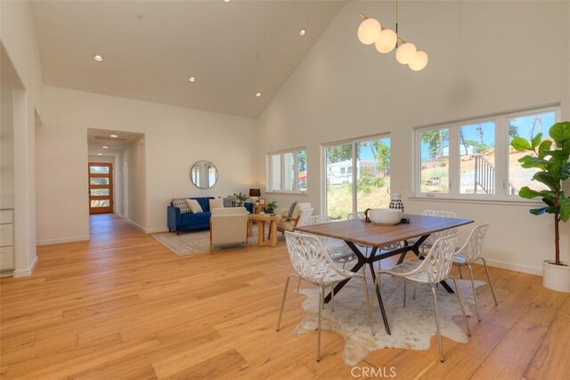 5351 Filbert St, Paradise, CA 95969 - dining room featuring high vaulted ceiling, light wood finished floors, and recessed lighting