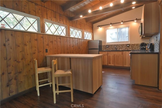 30607 Live Oak Dr, Running Springs, CA 92382 - kitchen with appliances with stainless steel finishes, healthy amount of natural light, dark countertops, wood walls, and wood ceiling