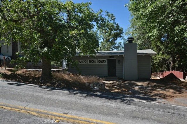 30607 Live Oak Dr, Running Springs, CA 92382 - view of front facade with a chimney