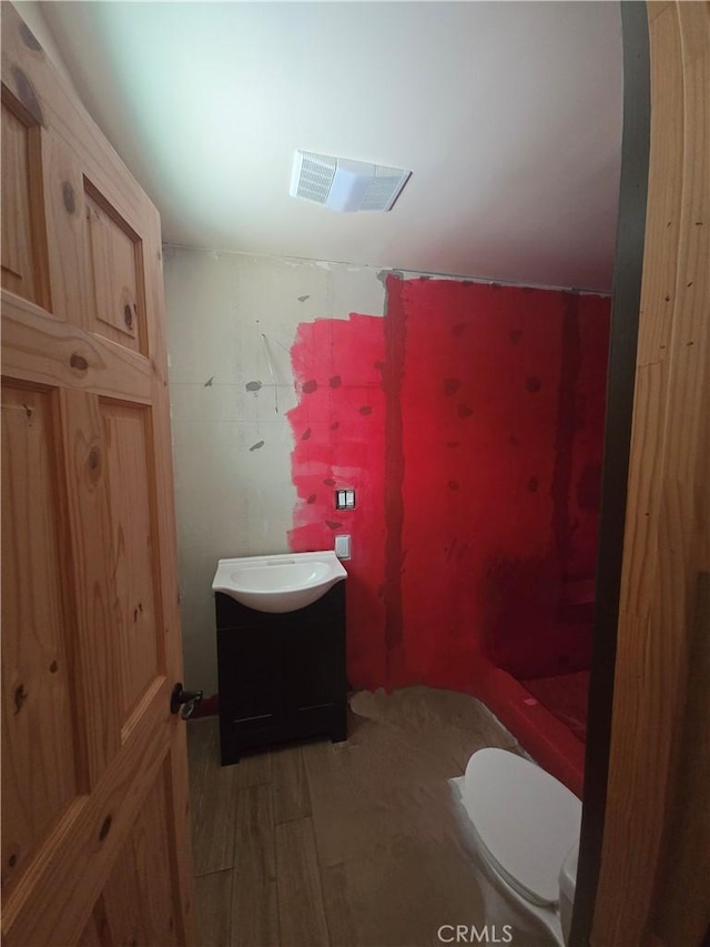30607 Live Oak Dr, Running Springs, CA 92382 - full bathroom featuring vanity, a shower with shower curtain, and wood finished floors