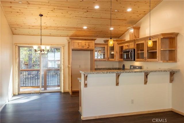 418 Los Angeles Ave, Sugarloaf, CA 92386 - kitchen featuring stainless steel microwave, lofted ceiling, wooden ceiling, light stone counters, and glass insert cabinets