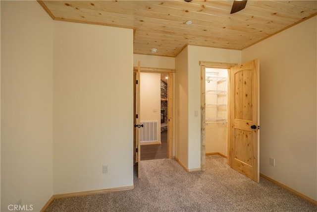 418 Los Angeles Ave, Sugarloaf, CA 92386 - unfurnished bedroom featuring wood ceiling, carpet, and a walk in closet