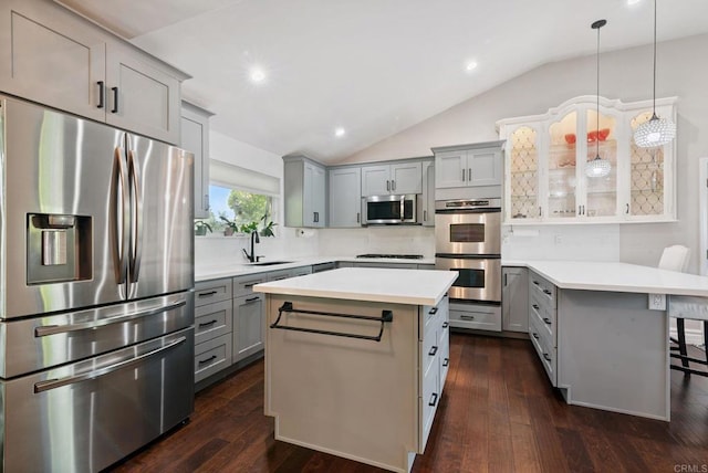 139 Parnassus Cir, Oceanside, CA 92054 - kitchen with appliances with stainless steel finishes, gray cabinetry, vaulted ceiling, light countertops, and decorative backsplash