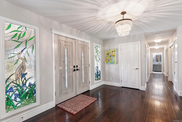 139 Parnassus Cir, Oceanside, CA 92054 - entryway featuring a chandelier, dark wood-type flooring, and healthy amount of natural light