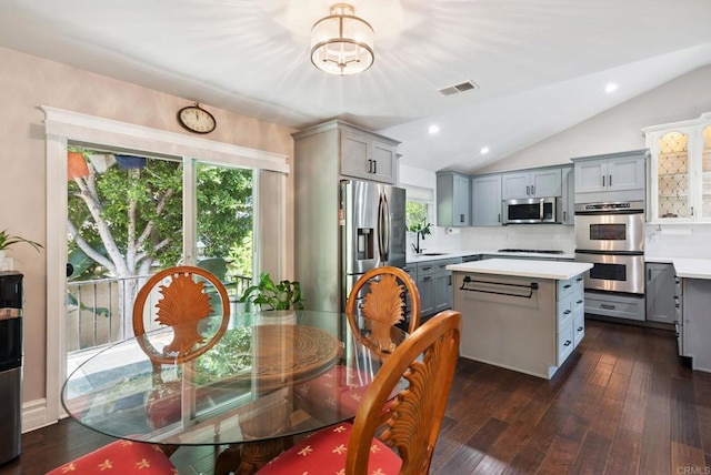 139 Parnassus Cir, Oceanside, CA 92054 - dining area featuring vaulted ceiling, a chandelier, dark wood-style flooring, and recessed lighting